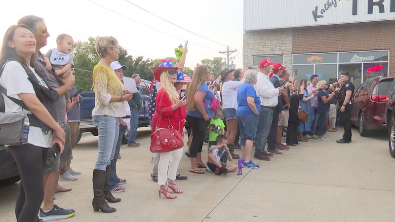 Supporters wait outside of Treehouse Pub and Eatery to see former President Donald Trump's...