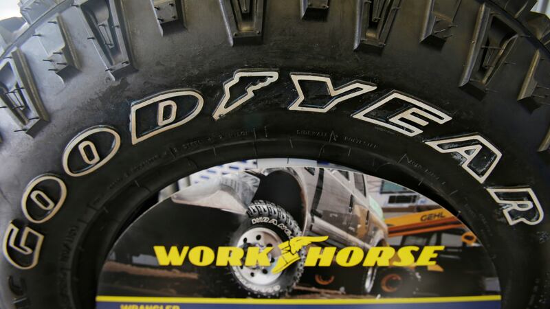FILE - A Goodyear tire sits on display at a tire shop on Feb. 12, 2014, in South Euclid,...
