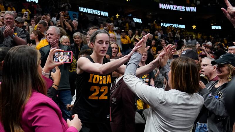 Iowa's Caitlin Clark celebrates after an NCAA Women's Final Four semifinals basketball game...