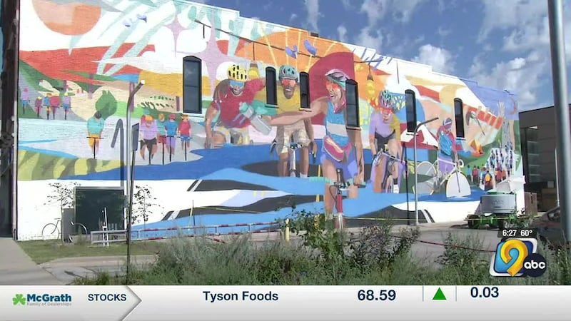 Spray paint artist pays tribute to cyclists in Cedar Rapids with massive mural