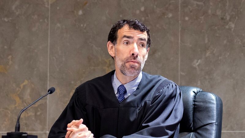 FILE - Fulton County, Ga., Superior Court Judge Robert McBurney instructs potential jurors...