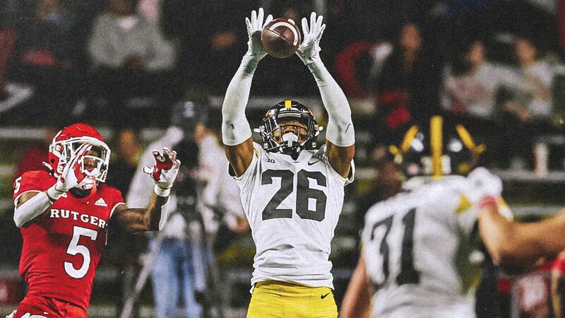 Kayvon Merriweather, center, goes for an interception against Rutgers on Saturday, Sept. 24,...
