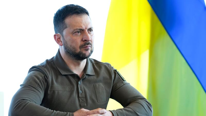 Ukrainian President Volodymyr Zelenskyy reacts during a meeting with President Joe Biden on...