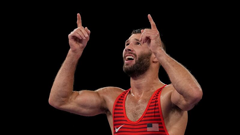 United Statess Thomas Patrick Gilman celebrates after defeating Iran's Reza Atrinagharchi...